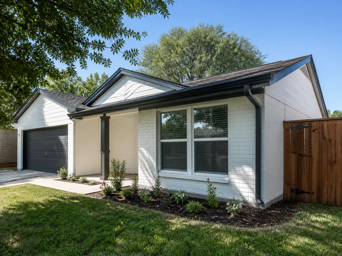 Representative North Texas exterior repaint with repaired fascia, trim, and fence